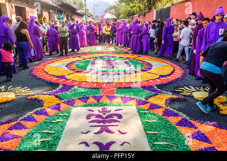 Antigua, Guatemala -  March 22, 2015: Dyed sawdust Lent procession carpets in UNESCO World Heritage Site with famous Holy Week celebrations. Stock Photo