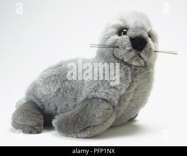 Grey toy seal, side view Stock Photo