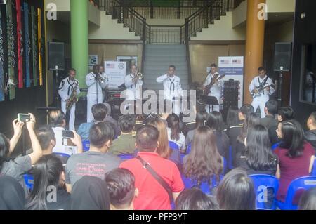 KOTA KINABALU, MALAYSIA (May 23, 2018) Members of the U.S. 7th Fleet Band perform at Universiti Malaysia Sabah in Kota Kinabalu, Malaysia. The band is supporting a U.S. 7th Fleet theater security cooperation mission and will be traveling to several Indo-Pacific countries in the coming weeks. Stock Photo