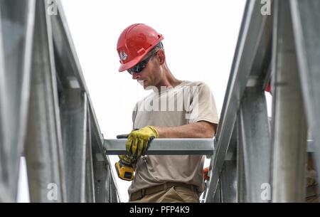 U.S. Air Force Master Sgt. Vince Catalfamo, 346th Air Expeditionary Group Rapid Engineer Deployable Heavy Operational Repair Squadron Engineer member who is deployed from Nellis Air Force Base, Nev., assembles a roof May 21, 2018 at a construction site in Meteti, Panama. Catalfamo is participating in Exercise New Horizons 2018, which is a joint training exercise where U.S. military members conduct training in civil engineer, medical, and support services while benefiting the local community. Stock Photo