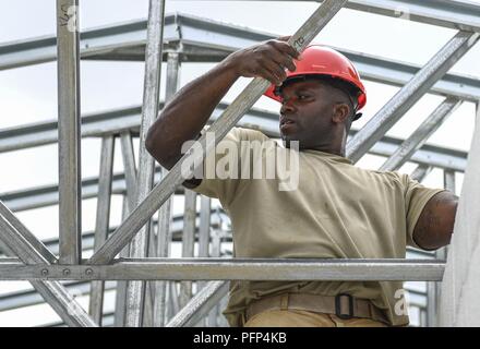 U.S. Air Force Capt. Anthony Williams, 346th Air Expeditionary Group Rapid Engineer Deployable Heavy Operational Repair Squadron Engineer member who is deployed from Nellis Air Force Base, Nev., assembles a roof May 21, 2018 at a construction site in Meteti, Panama. Williams is participating in Exercise New Horizons 2018, which is a joint training exercise where U.S. military members conduct training in civil engineer, medical, and support services while benefiting the local community. Stock Photo
