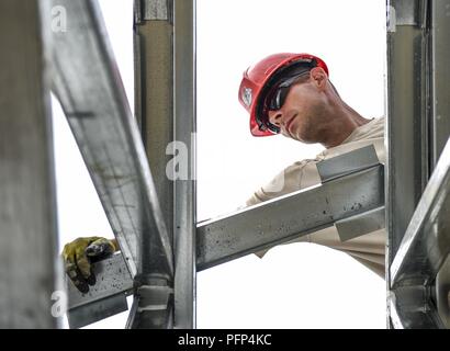 U.S. Air Force Master Sgt. Vince Catalfamo, 346th Air Expeditionary Group Rapid Engineer Deployable Heavy Operational Repair Squadron Engineer member who is deployed from Nellis Air Force Base, Nev., assembles a roof May 21, 2018 at a construction site in Meteti, Panama. Catalfamo is participating in Exercise New Horizons 2018, which is a joint training exercise where U.S. military members conduct training in civil engineer, medical, and support services while benefiting the local community. Stock Photo
