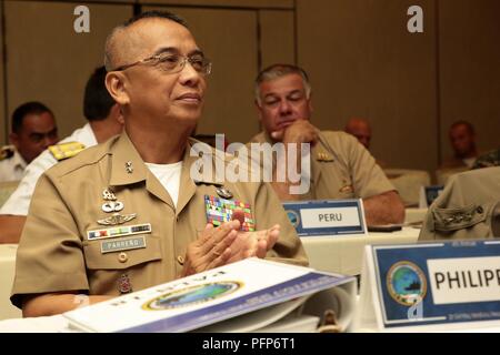 Maj. Gen. Alvin Parreño, commandant of the Philippine Marine Corps claps at the closing of the Pacific Amphibious Leaders Symposium (PALS) in Honolulu, Hawaii, May 24, 2018. PALS brings together senior leaders of allied and partner militaries with significant interest in the security and stability of the Indo-Pacific region to discuss key aspects of maritime/amphibious operations, capability development, crisis response and interoperability. Stock Photo