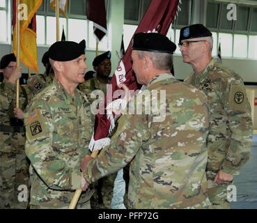 Maj. Gen. Jeffrey Clark, U.S. Army Medical Command Deputy Commanding General (Operations), passes the colors to Brig. Gen. Ronald Stephens, incoming Regional Health Command Europe commander, signifying his assumption of command of RHCE during a change of command ceremony, May 23, 2018 at Sembach Kaserne, Germany Stock Photo