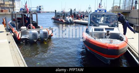 Coast Guard assets from Coast Guard Sector Delaware Bay and the Coast Guard Auxiliary in Philadelphia enforce a safety zone for the parade of sail for Sail Philadelphia 2018 as tall ships from around the world transit the Delaware River in Philadelphia, May 24, 2018. Ships will be docked along the Delaware River Waterfront from Market Street to the end of the Penn’s Landing Marina. Stock Photo