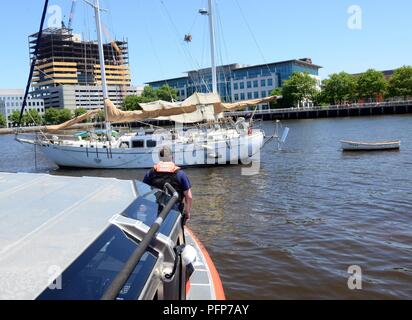 Coast Guard assets from Coast Guard Sector Delaware Bay and the Coast Guard Auxiliary in Philadelphia enforce a safety zone for the parade of sail for Sail Philadelphia 2018 as tall ships from around the world transit the Delaware River in Philadelphia, May 24, 2018. Ships will be docked along the Delaware River Waterfront from Market Street to the end of the Penn’s Landing Marina. Stock Photo