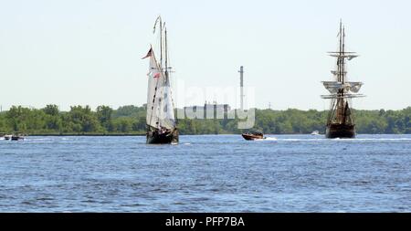 Coast Guard assets from Coast Guard Sector Delaware Bay and the Coast Guard Auxiliary in Philadelphia enforce a safety zone for the parade of sail for Sail Philadelphia 2018 as tall ships from around the world transit the Delaware River in Philadelphia, May 24, 2018. Ships will be docked along the Delaware River Waterfront from Market Street to the end of the Penn’s Landing Marina. Stock Photo