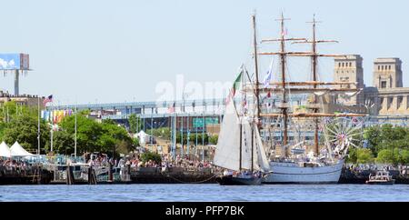 Coast Guard assets from Coast Guard Sector Delaware Bay and the Coast Guard Auxiliary in Philadelphia enforce a safety zone for the parade of sail for Sail Philadelphia 2018 as tall ships from around the world transit the Delaware River in Philadelphia, May 24, 2018. Ships will be docked along the Delaware River Waterfront from Market Street to the end of the Penn’s Landing Marina. Stock Photo