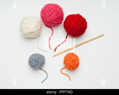 Crochet hook with pink ball of wool on a pink background Stock Photo ...