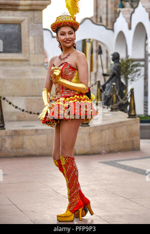 Caporales dancers in colourful costumes performing as they parade through the mining city of Potosi, ahead of Bolivian Independence Day. Stock Photo