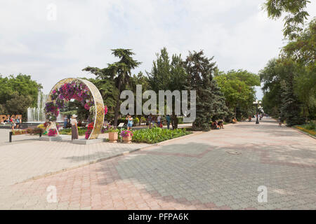 Evpatoria, Crimea, Russia - June 29, 2018: Alley in the Lenin Garden in Evpatoria, Crimea Stock Photo