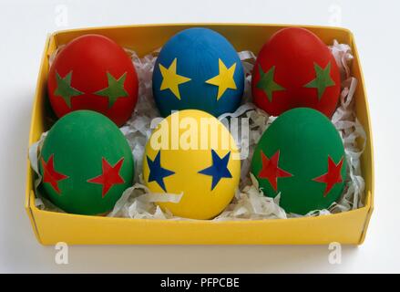 Six colourful eggs in box Stock Photo