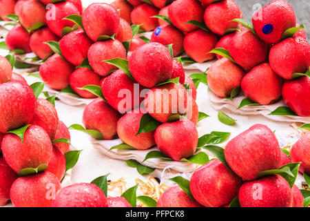Red apples for sale on street market stall, Bangkok, Thailand Stock Photo