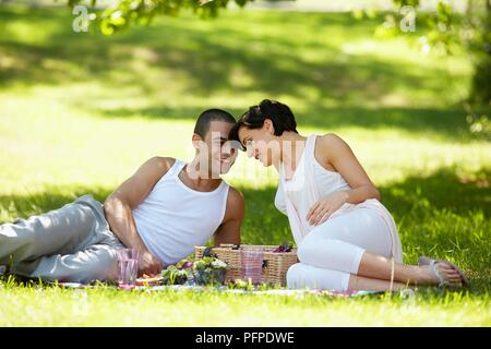Young couple picnic in the park Stock Photo - Alamy