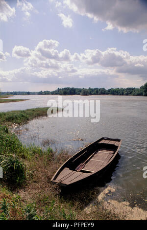 Wooden boat on the river bank at the wooden pier Stock Photo - Alamy
