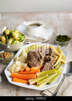 Pot-au-feu, stewed beef served with carrots, leek, parsnips, carrots, potatoes Stock Photo
