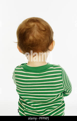 Little boy in green stripey top brown hair (Model age - 22 months) Stock Photo