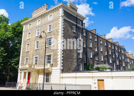 Exterior of Georgian residential apartment building made in yellow brick in a luxury residential area of West London. Stock Photo