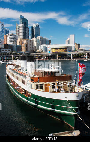 Australia, New South Wales, Sydney, National Maritime Museum in old fashioned ferry moored in Darling Harbour with skyscrapers in background Stock Photo