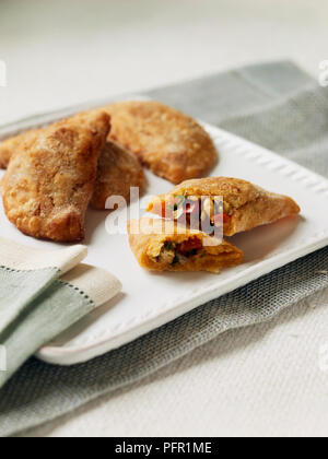 Empanadas stuffed with onions, red peppers, jalapenos, chickpeas Stock Photo