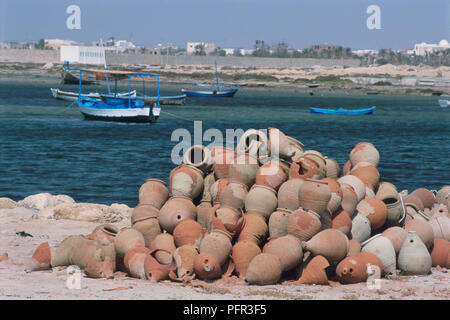 Tunisia, Jerba, Ajim, pots used for catching octopus on harbourside of fishing village Stock Photo