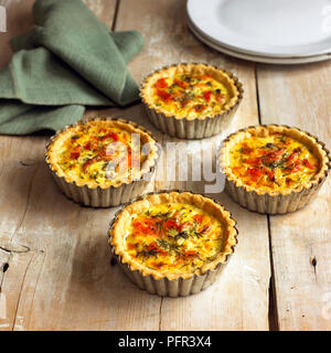 Smoked trout tartlets in silver tins Stock Photo