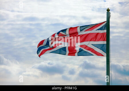 Union Jack against cloudy sky, close-up Stock Photo