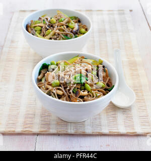 Mixed mushroom and pak choi stir-fry with soba noodles Stock Photo