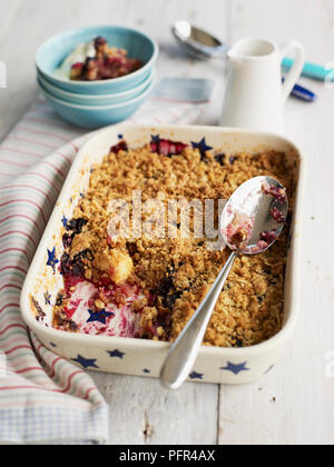 Apple and grape crumble bake in pie dish Stock Photo