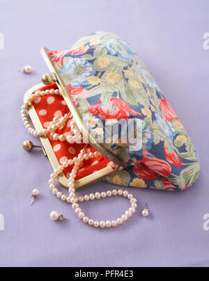 Clasp-frame purse or bag containing pearl necklace Stock Photo