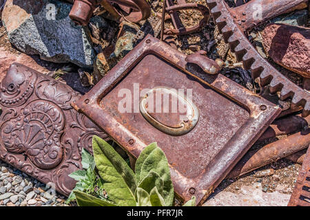 Rusty vintage doors and large rusty vintage gear Stock Photo