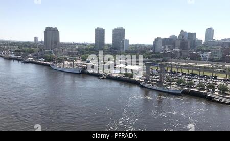 The Coast Guard enforces a safety zone as tall ships from around the world transit the Delaware River in Philadelphia for Sail Philadelphia 2018, May 24, 2018. Ships will be docked along the Delaware River Waterfront from Market Street to the end of the Penn’s Landing Marina. Stock Photo