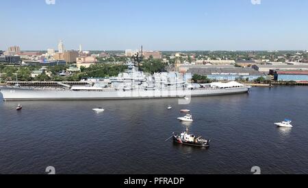 The Coast Guard Cutter Cleat enforces a safety zone as tall ships from around the world transit the Delaware River in Philadelphia for Sail Philadelphia 2018, May 24, 2018. Ships will be docked along the Delaware River Waterfront from Market Street to the end of the Penn’s Landing Marina. Stock Photo