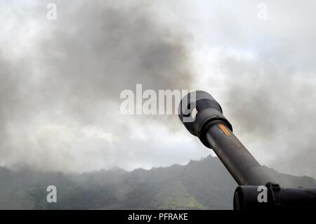 An M119A3 Howitzer assigned to 3rd Battalion, 7th Field Artillery Regiment, 25th Division Artillery, 25th Infantry Division, is fired during the Tiger Balm 18 live fire exercise at Schofield Barracks, Hawaii, on May 24, 2018. Tiger Balm is a bilateral exercise held yearly between the U.S. and Singapore armies. Stock Photo