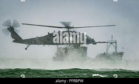 An Air Force Reserve pararescueman from the 920th Rescue Wing jumps out of an HH-60G Pave Hawk helicopter on May 26th, 2018 during the 2nd annual Salute to American Heroes Air and Sea Show, in Miami Beach. This two-day event showcases military fighter jets and other aircraft and equipment from all branches of the United States military in observance of Memorial Day, honoring servicemembers who have made the ultimate sacrifice. Stock Photo