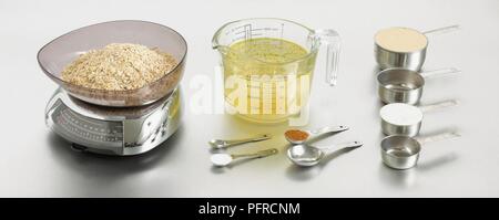 Cooking utensils, including scales, measuring jug, measuring cups, measuring spoons Stock Photo