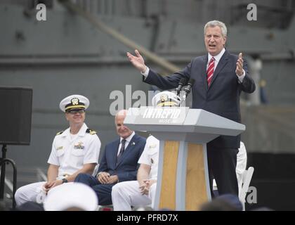 NEW YORK (May 28, 2018) New York City Mayor Bill de Blasio makes opening remarks at a Memorial Day ceremony at the Intrepid Sea, Air and Space Museum in New York City during Fleet Week New York 2018. Now in its 30th year, Fleet Week New York is the city’s time-honored celebration of the sea services. It is an unparalleled opportunity for the citizens of New York and the surrounding tri-state area to meet Sailors, Marines and Coast Guardsmen, as well as witness firsthand the latest capabilities of today’s maritime services. Stock Photo