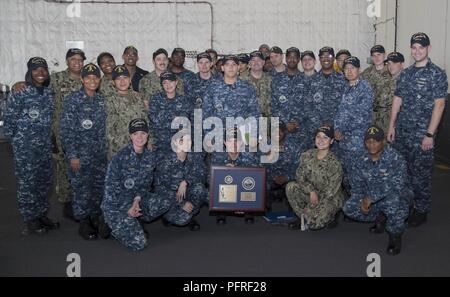 NORFOLK, Va. (May 24, 2018) -- USS Gerald R. Ford (CVN 78) Sailors assigned to Ford's administration department pose for a group photo after an awards ceremony in the ship's hangar bay. Stock Photo