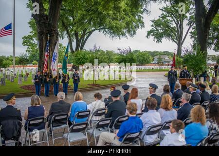 FORT BENNING, Ga. (May 30, 2018) -- Soldiers, veterans and civilians attend the Fort Benning Memorial Day Ceremony May 28, 2018, at the Main Post Cemetery.  Maj. Gen. Gary M. Brito, commanding general of the Maneuver Center of Excellence and Fort Benning, and MCoE and Fort Benning Command Sgt. Maj. Scott A. Brzak laid the ceremonial wreath. Stock Photo