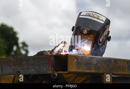 U.S. Marine Corps Reserve Lance Cpl. Shane Navarro, 346th Air Expeditionary Group welder who is deployed from the 6th Engineer Support Battalion, Peoria, Illinois, welds a water tank structure May 26, 2018, in Meteti, Panama. The Marines worked alongside U.S. Air Force Airmen from the 820th Rapid Engineer Deployable Heavy Operational Repair Squadron Engineer Squadron, Nellis Air Force Base, Nevada, and support Airmen from all over the United States during Exercise New Horizons 2018. The exercise is a joint training exercise where U.S. military members conduct training in civil engineer, medica Stock Photo