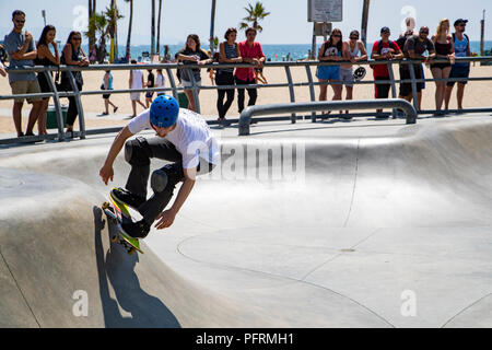 Venice Beach Skate Park, LA: One skateboarder in front of a crowd Stock Photo
