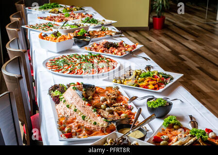 Party Brunch big Buffet table setting with Food Meat Vegetables Stock Photo  - Alamy