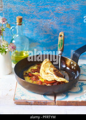 Omelette basquaise from the French Basque region, eggs cooked with piperade (pepper and tomato sauce) Stock Photo