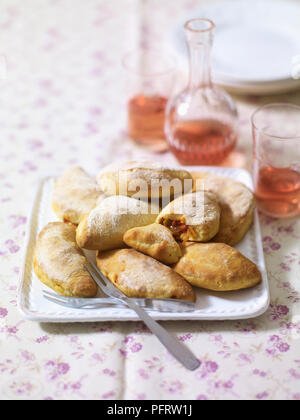 Panzerotti, Italian savoury pasties stuffed with onions and olives Stock Photo