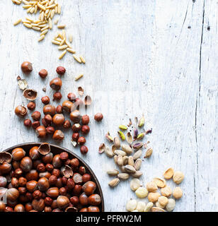 A selection of nuts on wood background Stock Photo