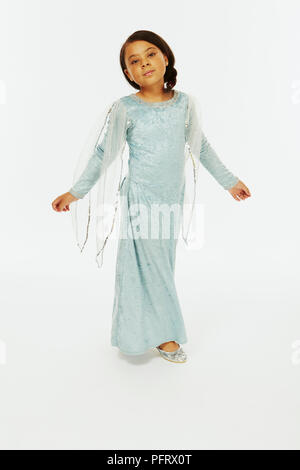 Girl dressed as princess in blue velvet dress Stock Photo