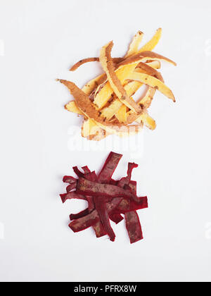 Piles of sweet potato and beetroot peel on a white background Stock Photo