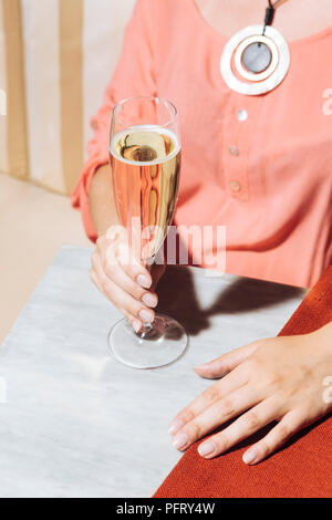 Prosecco glass in an elegant bar with vintage pop colors Stock Photo