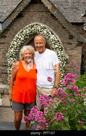 UK, Cornwall, Trebetherick, Daymer Bay, Saint Enodoc’s Church, couple celebrating 36th wedding anniversary Stock Photo