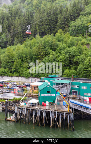 The cable car on Mount Roberts Tramway and the ice house for Taku Fisheries in the harbour at Juneau the capital city of Alaska, USA Stock Photo